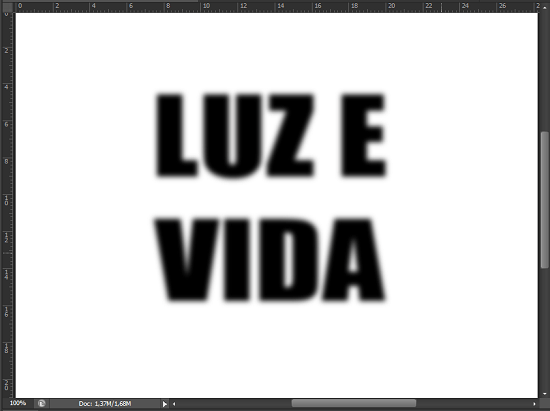 O texto após a aplicação do filtro Gaussian Blur. Efeito de texto com explosão de luz